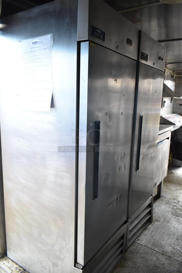 2019 Cruising Kitchens cold food trailer interior, featuring Arctic Air coolers and freezers with visible labels and mild wear.