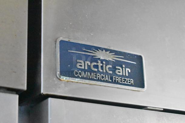 Arctic Air commercial freezer label on stainless steel surface, indicating included equipment in the 2019 Cruising Kitchens trailer.