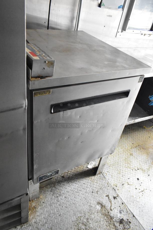 2019 Cruising Kitchens 8.5' x 24' trailer with Arctic Air prep table, visible wear, "Refrigerator" label, single axle.