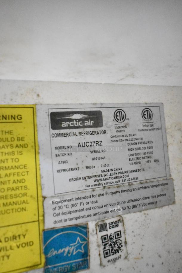 Label on Arctic Air commercial refrigerator, Model AUC27RZ, listing specifications and certifications, including refrigerant R600a.