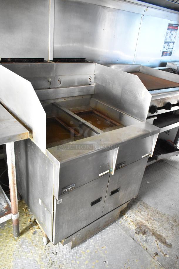 2019 Cruising Kitchens trailer interior; features Pitco fryers and stainless steel surfaces. Used condition. Clear title.