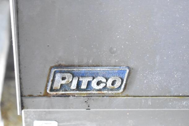 Close-up of a Pitco brand logo on a metal surface of the 2019 Cruising Kitchens cold food & beverage trailer.