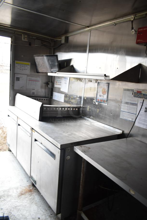 2019 Cruising Kitchens 8.5' x 24' trailer interior with stainless steel counters, Arctic Air coolers, and fire suppression system.