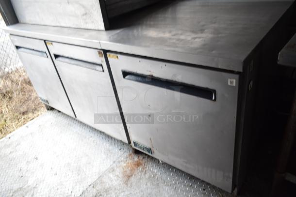 2019 Cruising Kitchens trailer interior showing Arctic Air coolers and freezers. Visible wear. Clear title included.