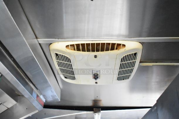 Interior of 2019 Cruising Kitchens trailer, showing ceiling-mounted air vent system. Sturdy metal ceiling, good condition.