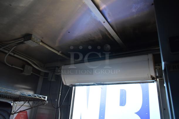 Interior view of 2019 Cruising Kitchens 8.5' x 24' trailer showing wiring and ventilation system.