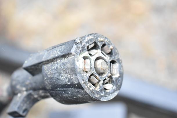 Close-up of a trailer connector for a 2021 Nationwide 8.5' x 24' food trailer shell, ready to be equipped and sold with clear title.