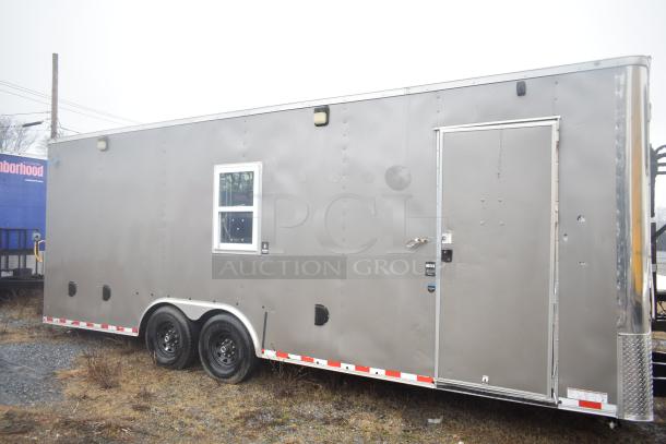 2021 Nationwide 8.5' x 24' food trailer shell, gray exterior, ready to equip, clear title, visible door and window.