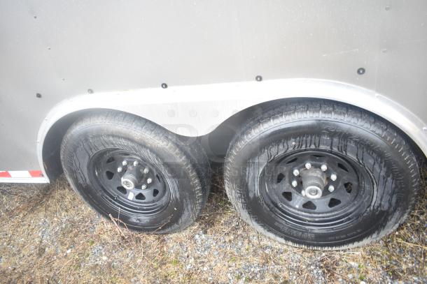 2021 Nationwide 8.5' x 24' food trailer shell with dual black wheels, ready to equip. Clear title included.