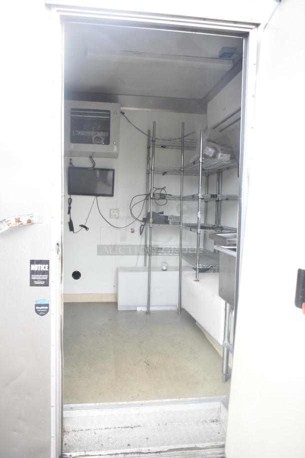 2021 Nationwide 8.5'x24' food trailer shell, interior view, wire shelving, Martin IT cabinet, sold with clear title.