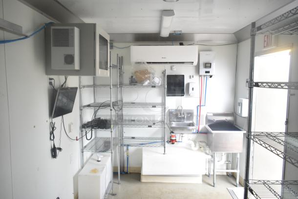 2021 Nationwide 8.5' x 24' food trailer shell; features sinks, wire shelving, Martin IT/Network cabinet; clear title.