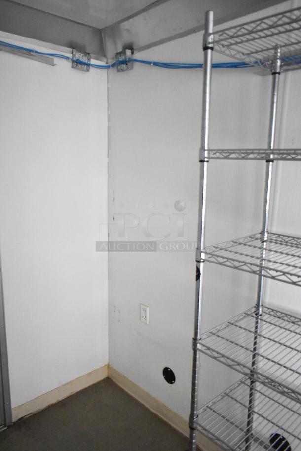 2021 Nationwide 8.5' x 24' food trailer interior with wire shelving and network cabinet, ready for customization. Clear title.