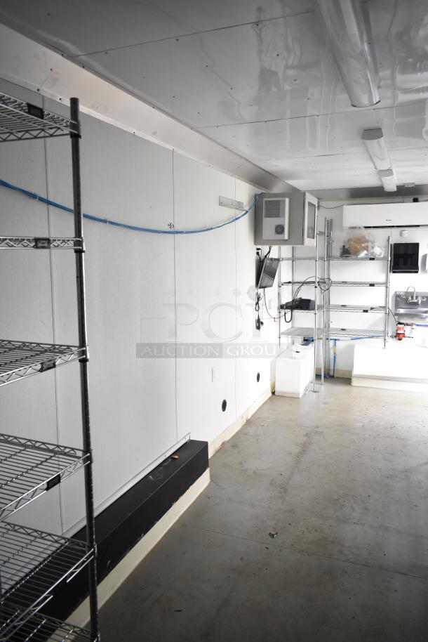2021 Nationwide 8.5' x 24' food trailer shell with wire shelving, sinks, and Martin IT cabinet; ready for customization.