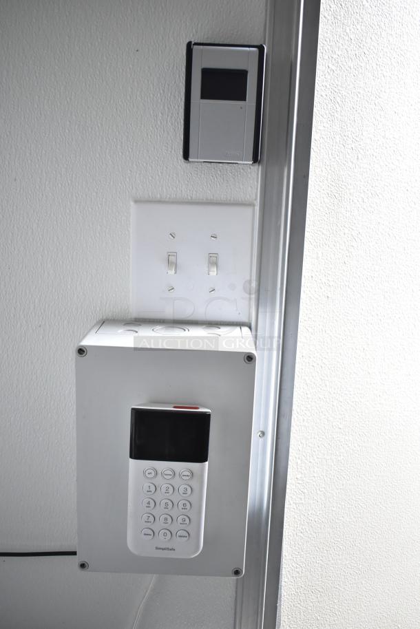 Control panel and keypad inside 2021 Nationwide 8.5' x 24' food trailer shell, featuring switches and alarm system.