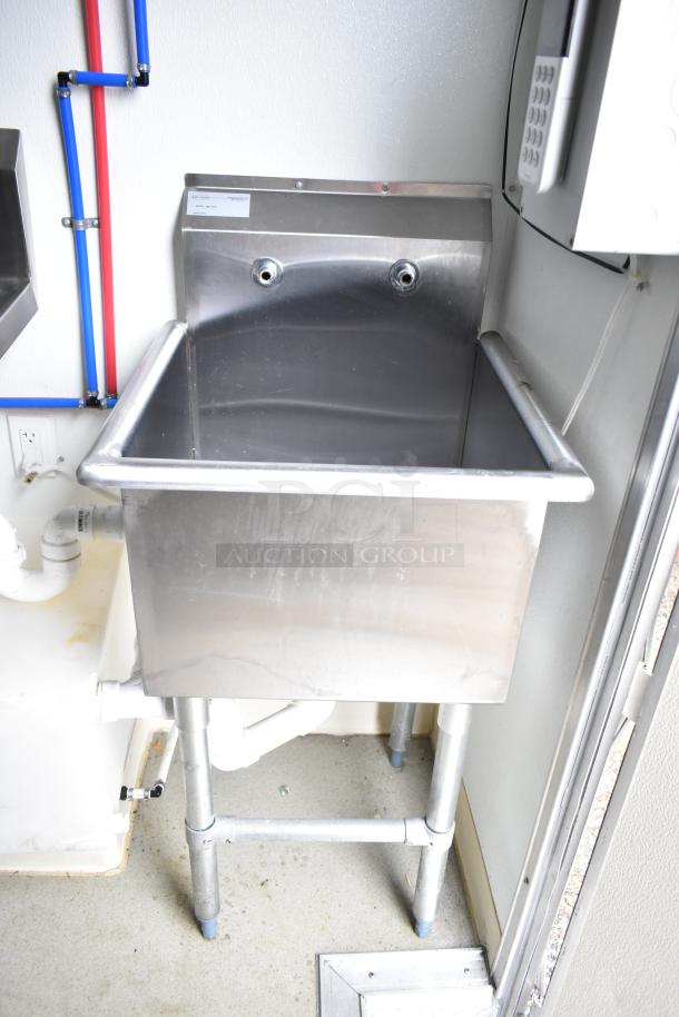 Stainless steel sink in a 2021 Nationwide 8.5' x 24' food trailer shell, with plumbing fixtures installed.