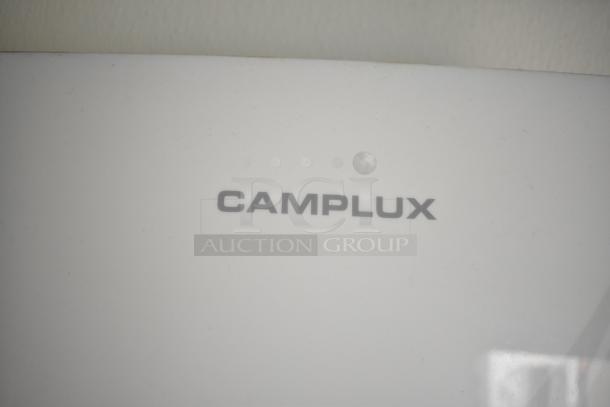 White surface with "CAMPLUX" text; no visible food trailer features present.