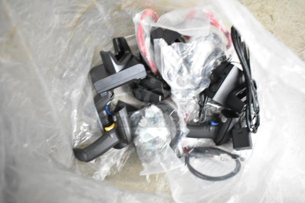 A collection of disassembled electronic components and cables in a plastic bag, containing various parts for assembly.