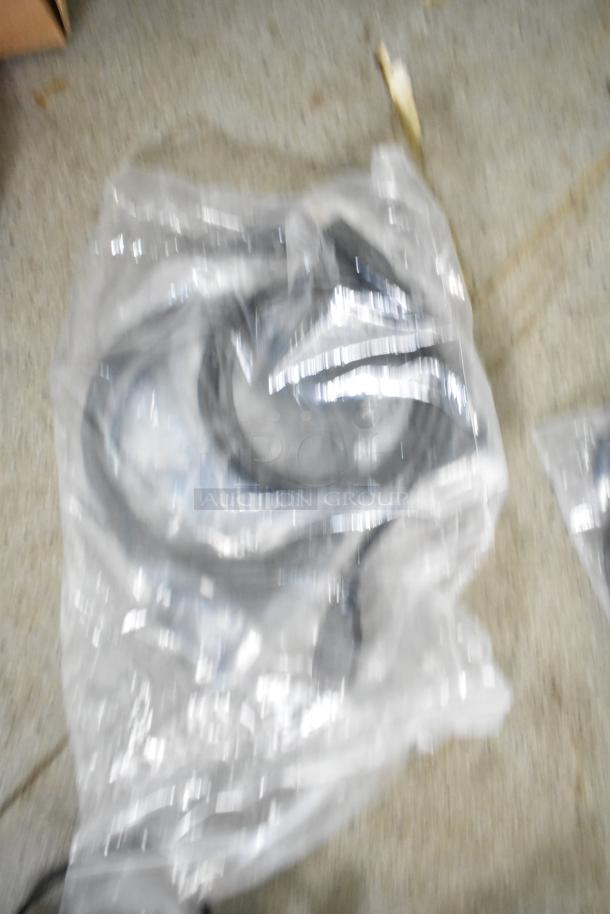 Sealed plastic bag containing coiled wires, part of the 2021 Nationwide 8.5' x 24' food trailer shell.