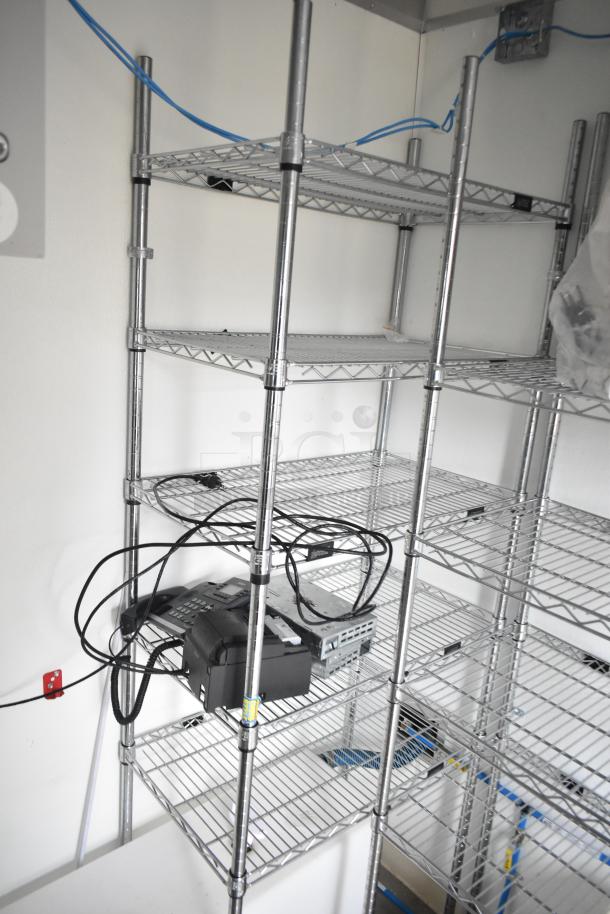 2021 Nationwide 8.5' x 24' food trailer shell with wire shelving units and Martin IT cabinet, ready for customization.