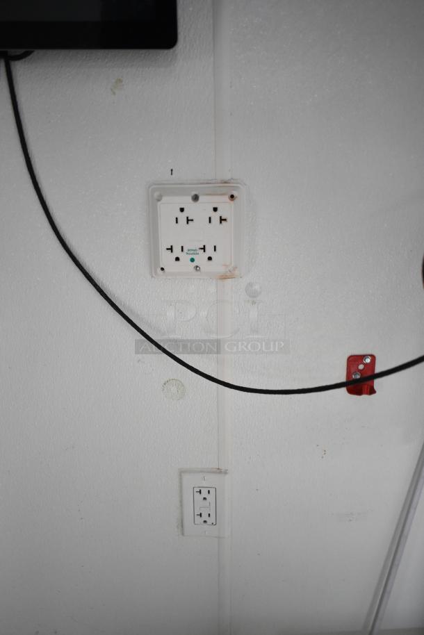 2021 Nationwide 8.5' x 24' food trailer interior, showcasing electrical outlets and wiring, ready for custom installation.