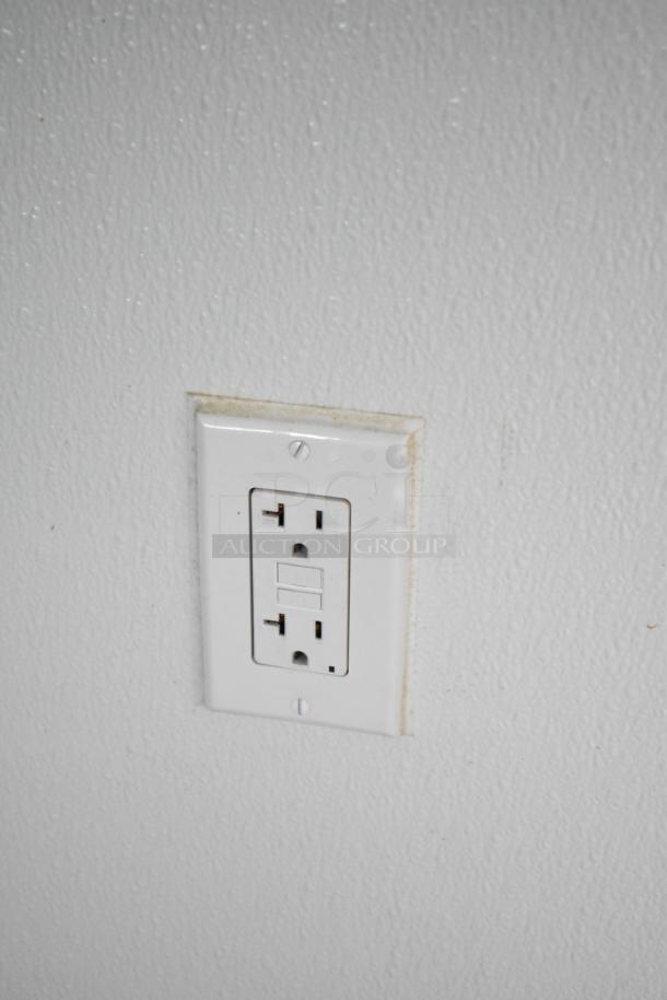 Power outlet on the interior wall of a 2021 Nationwide 8.5' x 24' food trailer shell.