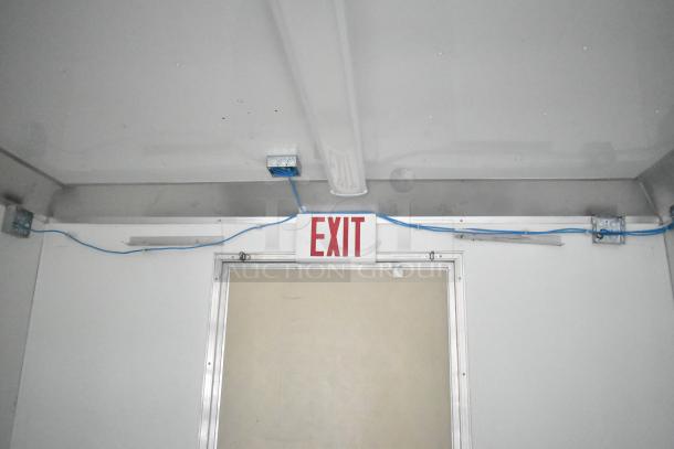 2021 Nationwide 8.5' x 24' food trailer shell interior showing exit sign and wiring setup. Ready for customization.