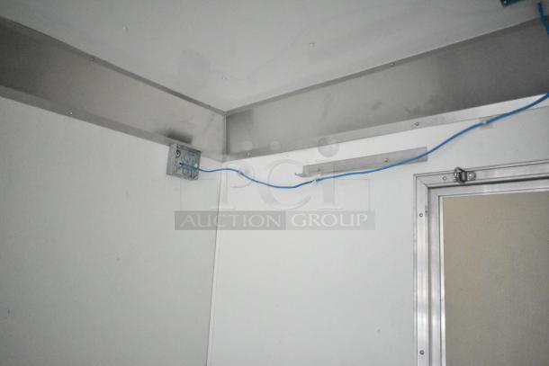 2021 Nationwide 8.5' x 24' food trailer shell interior, showing metal framing and wiring for customization. Sold with clear title.