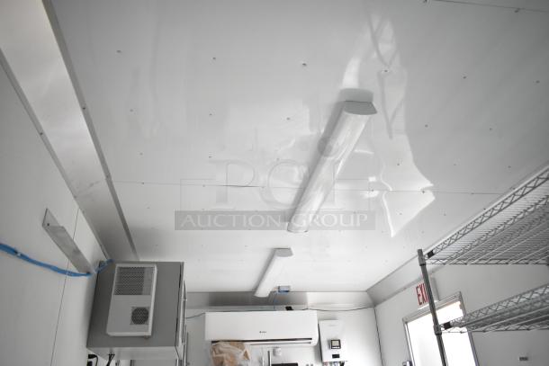 2021 Nationwide 8.5' x 24' food trailer shell interior, featuring sinks, wire shelving units, Martin IT/Network cabinet. Clear title.