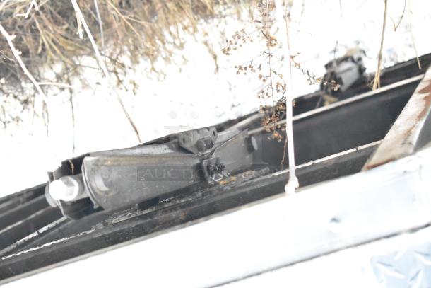 Alt text: Underside view of 2020 SDG 8.5' x 20' food trailer shell frame; ready for customization, sold with clear title.