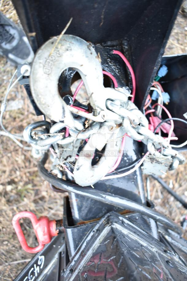 Chain and hook on a 2020 SDG food trailer shell. Appears in good condition with visible wiring. Ready for customization.