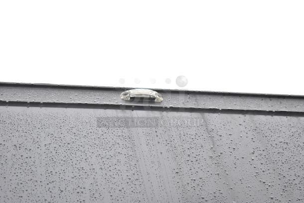 2020 SDG 8.5' x 20' food trailer shell exterior showing raindrop-covered surface, ready for customization.