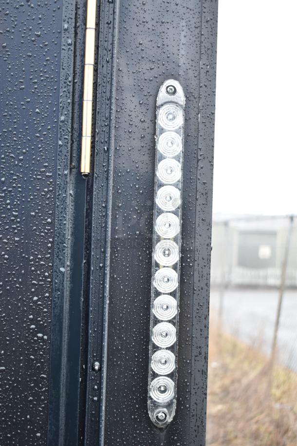 Raindrop-covered SDG food trailer shell hinge and LED light detail; ready for customization. Clear title included.