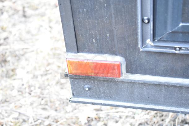 2020 SDG 8.5' x 20' food trailer shell, black exterior, corner marker light visible, ready for custom equipment.