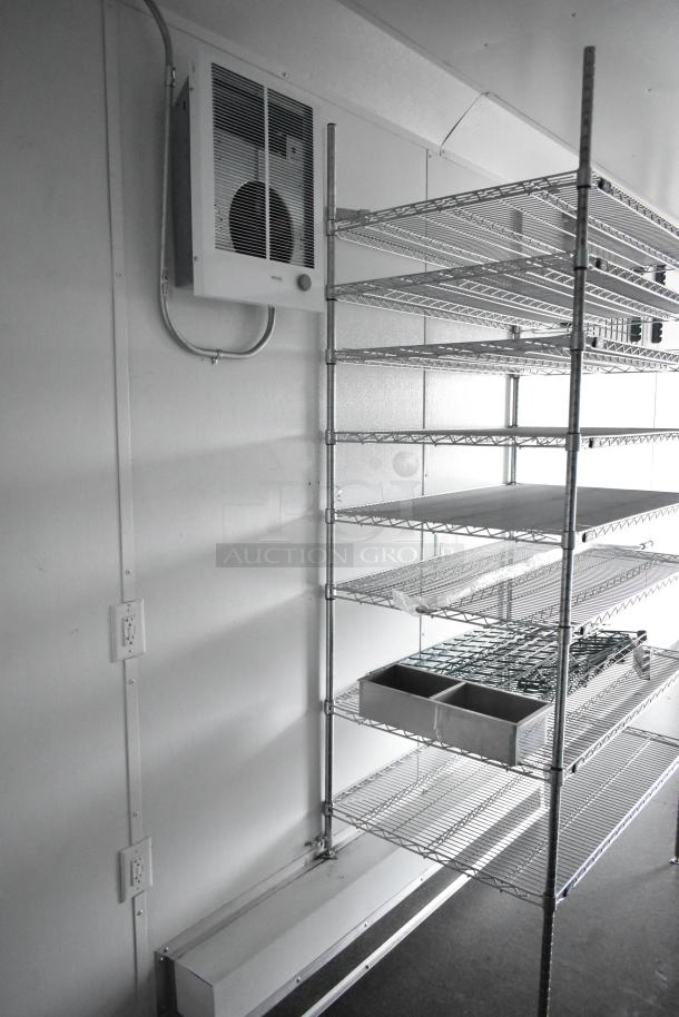 2020 SDG 8.5' x 20' food trailer shell with wire shelving units and Martin IT/Network cabinet, ready for customization.