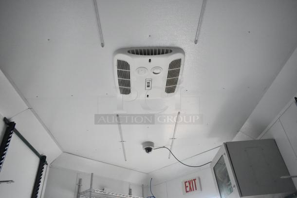 2020 SDG 8.5' x 20' food trailer shell interior with AC unit, wire shelving, and Martin IT/network cabinet; ready to equip.