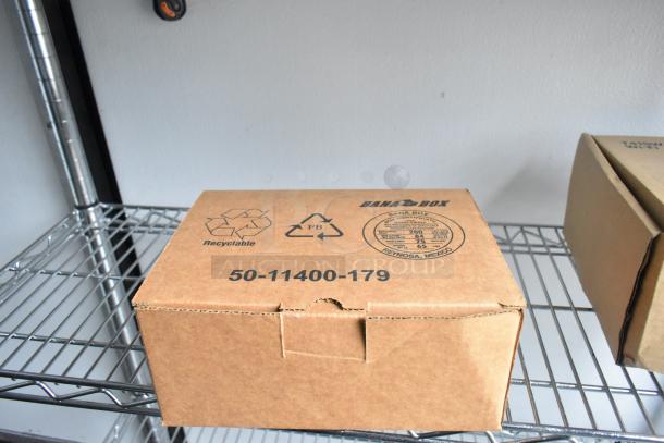 Cardboard box on wire shelving, labeled "Bana Box" with recycling symbols. Markings: "50-11400-179" and "Reynosa, Mexico."