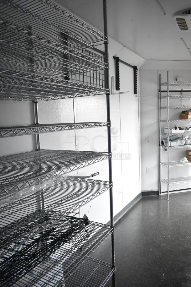 2020 SDG 8.5' x 20' food trailer shell with wire shelving units, ready for customization. Clear title included.