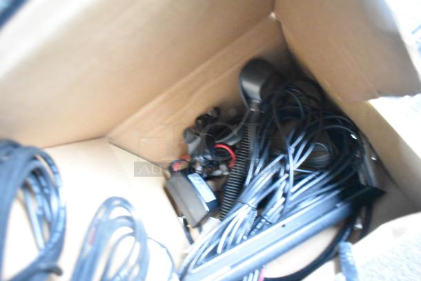Box containing various cables and electronic components for potential installation in a 2020 SDG food trailer shell.