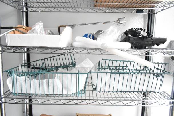Metal wire shelving inside the 2020 SDG 8.5' x 20' food trailer shell, featuring assorted items and materials.