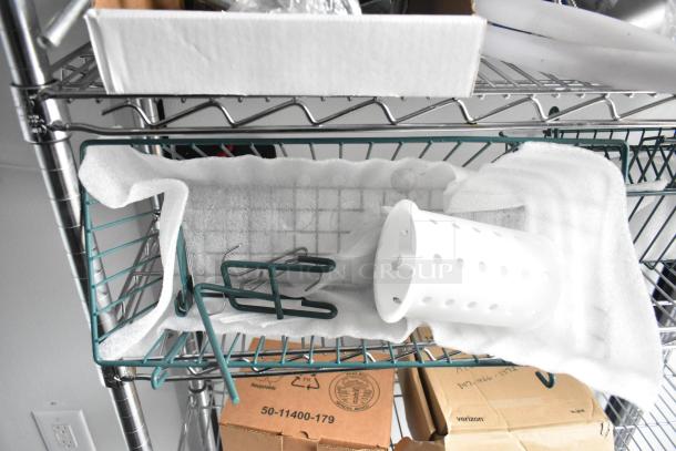 A wire shelving unit with foam padding, a white cylindrical holder, and a green metal bracket placed on a shelf.