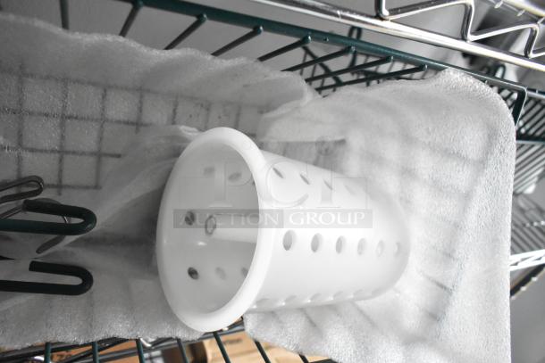 Metal wire shelving unit inside 2020 SDG 8.5' x 20' food trailer shell, showcasing ready-to-equip space for customization.