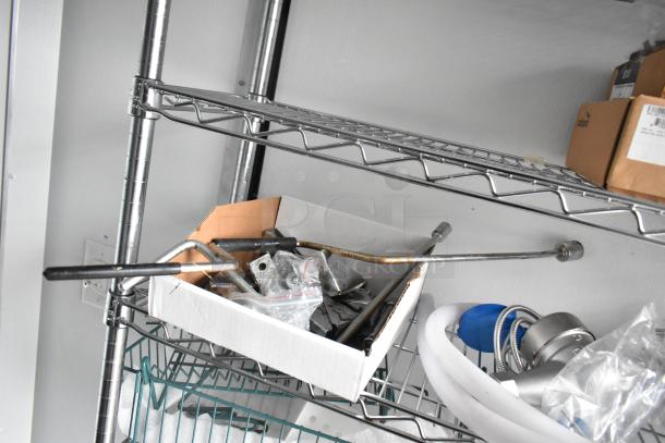 Metal wire shelving inside 2020 SDG 8.5' x 20' food trailer shell. Includes installation tools and components. Ready for customization.