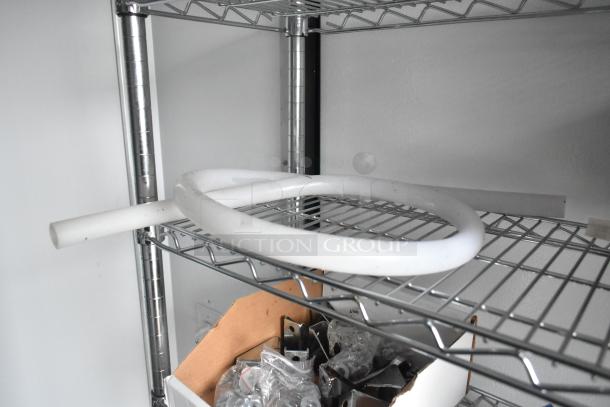 Wire shelving unit inside 2020 SDG 8.5' x 20' food trailer shell, ready for equipment installation. Features clear title.