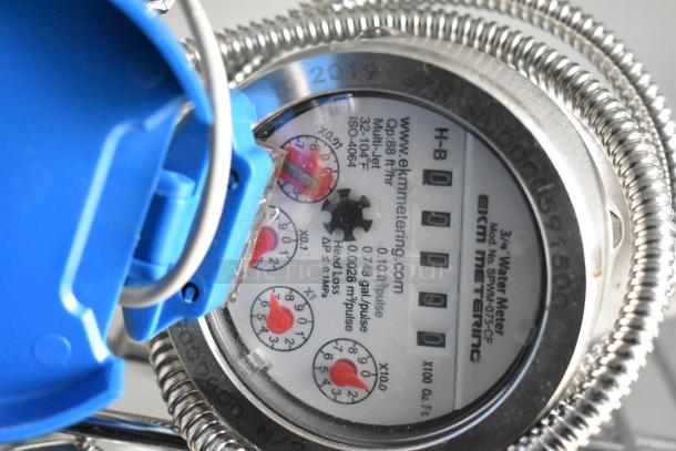 3/4" water meter from EKM Metering, featuring model SPWM-075CF. Shows meter readings and detailed specifications.
