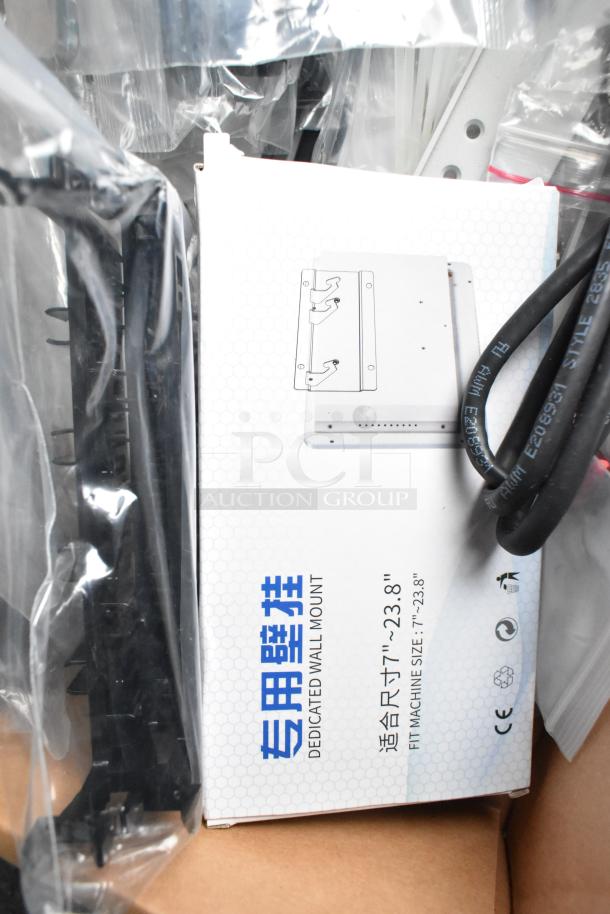 Box labeled "Dedicated Wall Mount," size 7"-23.8", with supporting hardware and cabling. Features multilingual text.