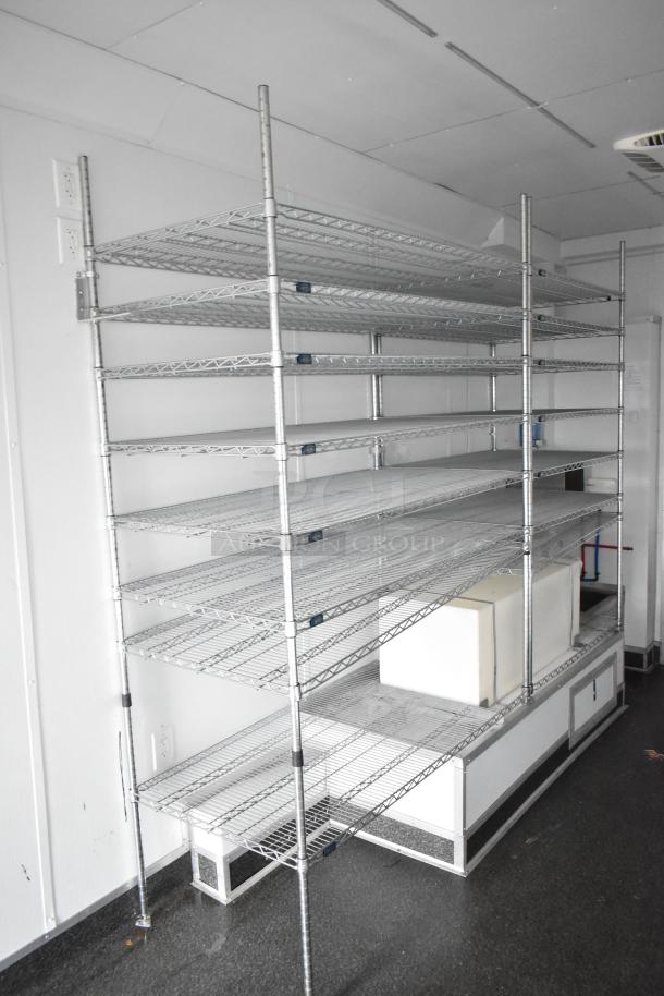 2020 SDG 8.5' x 20' food trailer shell interior with metal wire shelving units and Martin IT/Network cabinet.