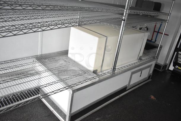 2020 SDG 8.5' x 20' food trailer shell with wire shelving, Martin IT/Network cabinet, and clear title. Ready for customization.