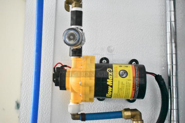 2020 SDG 8.5' x 20' food trailer shell interior showing Flow-Max pump and plumbing installation, ready for custom equipment.