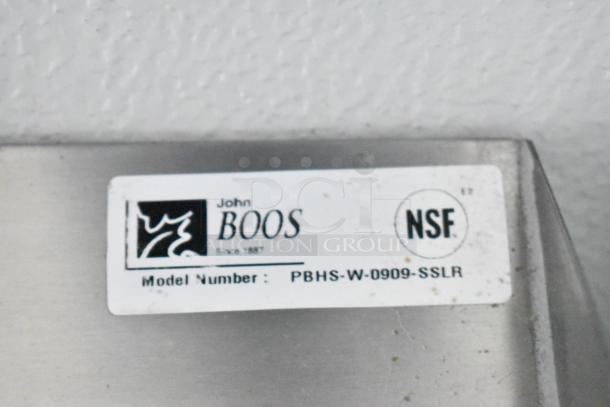 NSF sticker for John Boos, Model PBHS-W-0909-SSLR. Label on stainless steel surface.