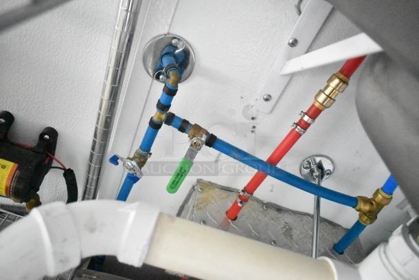 2020 SDG 8.5' x 20' food trailer plumbing setup with blue and red pipes, ready for customization.